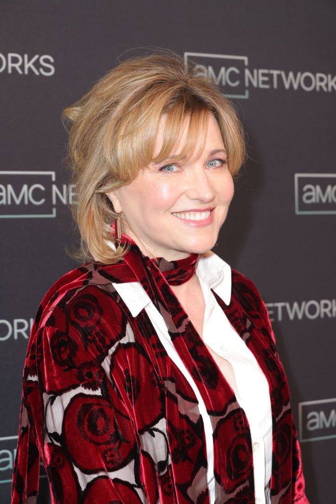 Jane Fonda smiles at an AMC Networks event, wearing a patterned velvet shawl over a white blouse