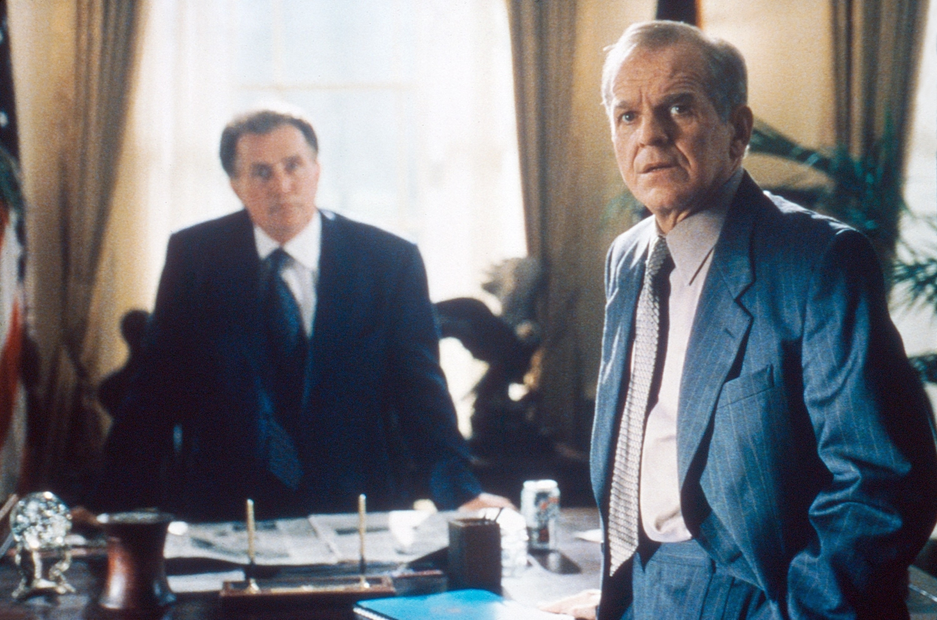 Martin Sheen and John Spencer wearing suits in a scene from "The West Wing"