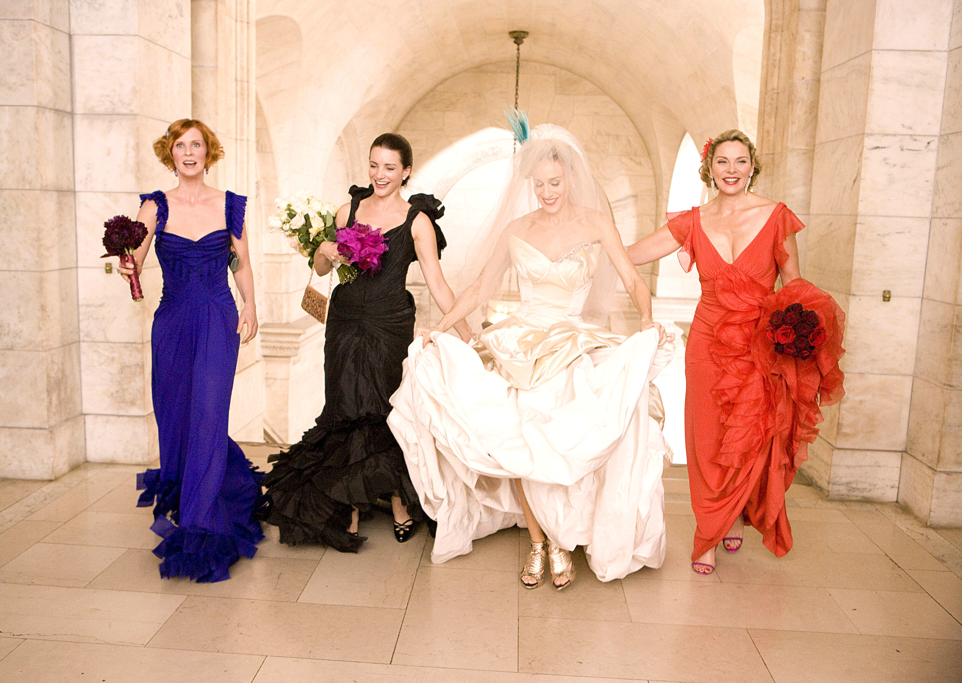 Cynthia Nixon, Kristin Davis, Sarah Jessica Parker, and Kim Cattrall in fancy gowns in a scene from &quot;Sex and the City: The Movie&quot;