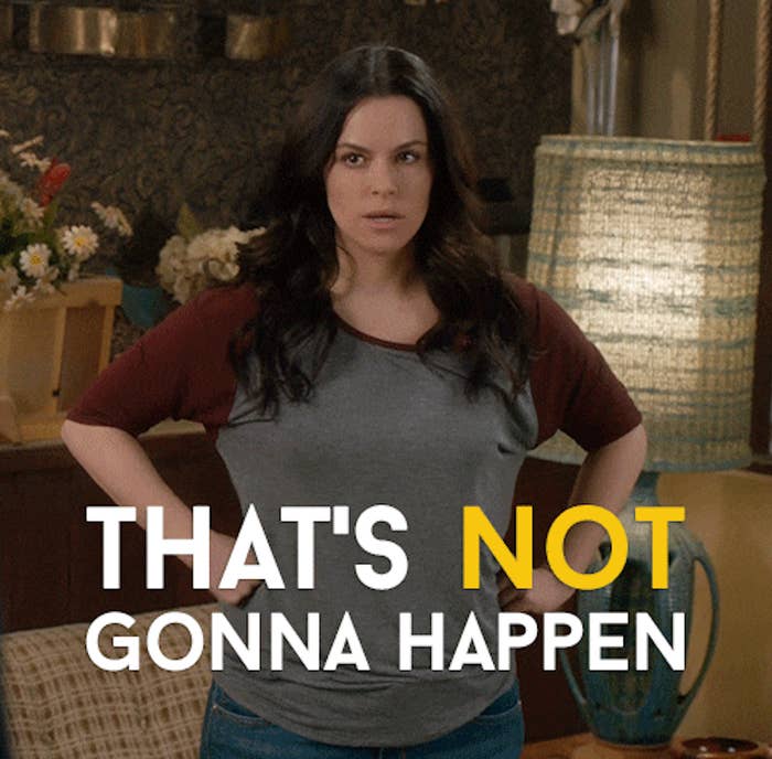 A woman with long dark hair, wearing a baseball shirt with maroon sleeves, stands indoors with hands on hips. Text in image: &quot;That's NOT gonna happen.&quot;