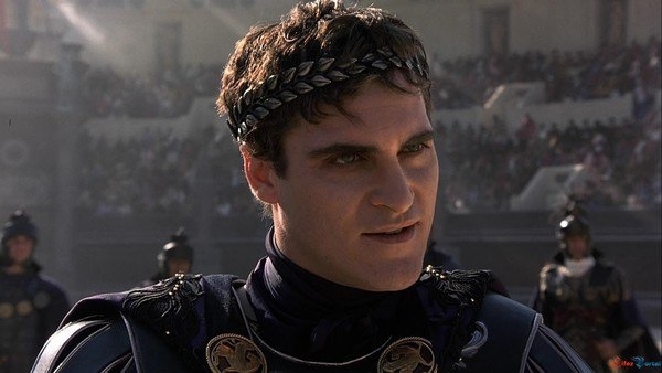 Joaquin Phoenix, dressed as Roman Emperor Commodus, wearing an ornate laurel wreath, in a scene from the movie Gladiator
