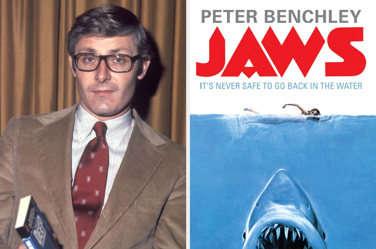 Peter Benchley holds a book while standing next to a poster of his novel &quot;Jaws&quot; featuring a shark and a swimmer with the text &quot;It&#x27;s never safe to go back in the water.&quot;