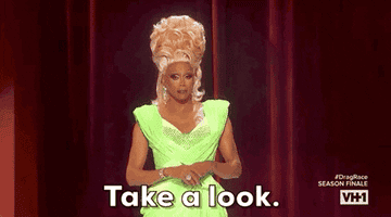 RuPaul wearing an elegant, flashy gown, with the text "Take a look." The image is from VH1's Drag Race Season Finale