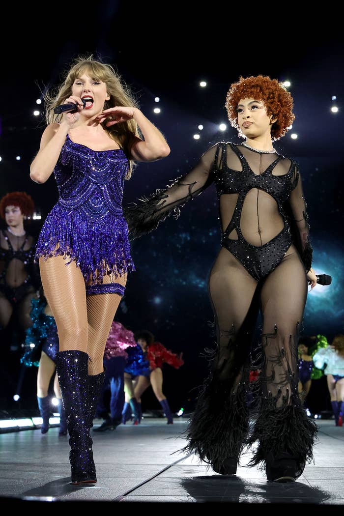 Taylor Swift performs in a sparkly outfit next to Ice Spice in a sheer bodysuit on stage