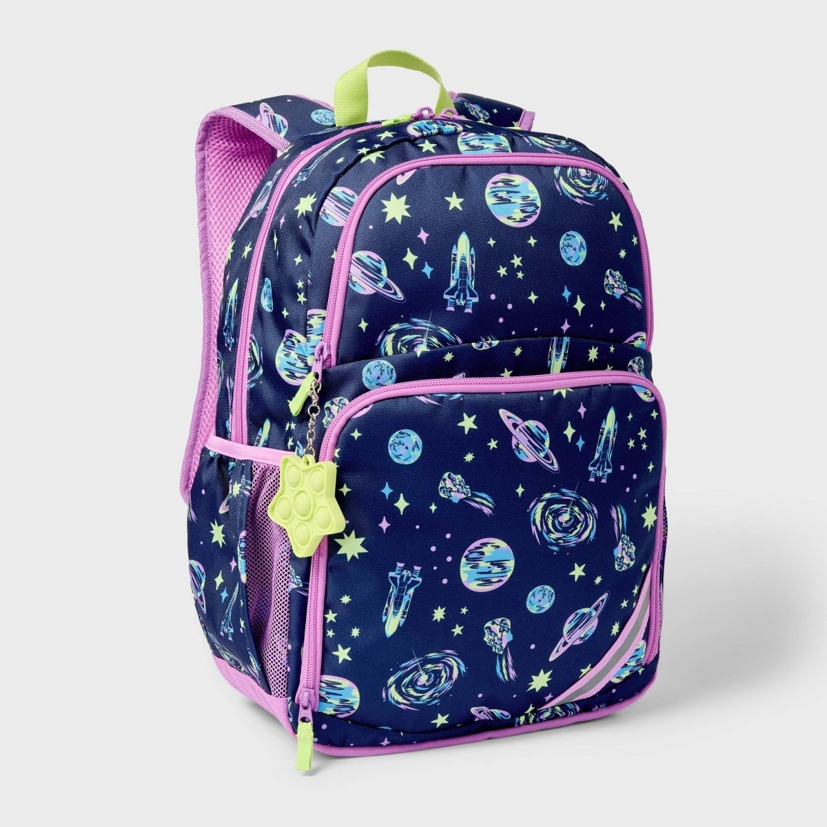 Backpack with space-themed design, including rockets, planets, and stars, with pink trim and a yellow paw-shaped zipper pull