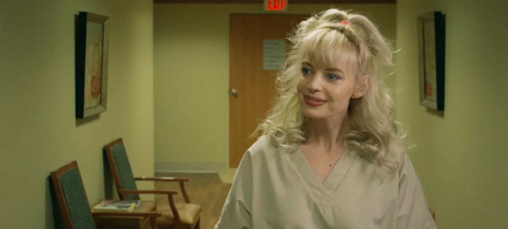 Chloe Farmworth wearing beige scrubs in a scene from "12 Hour Shift"