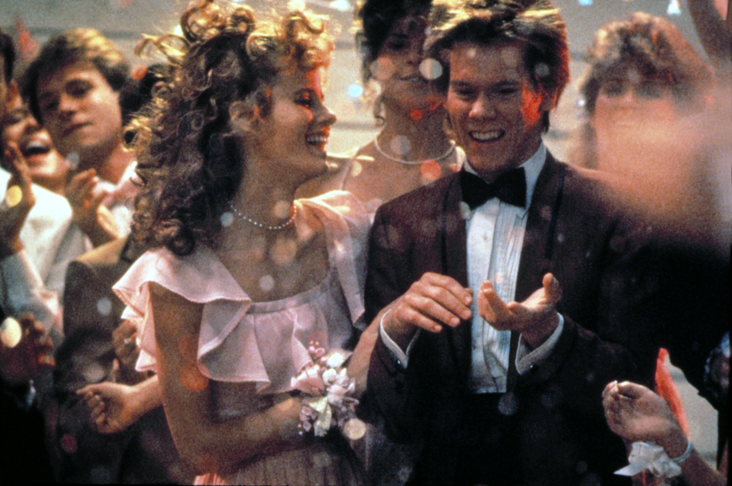 Kevin Bacon and Lori Singer in formal attire in a scene from "Footloose"