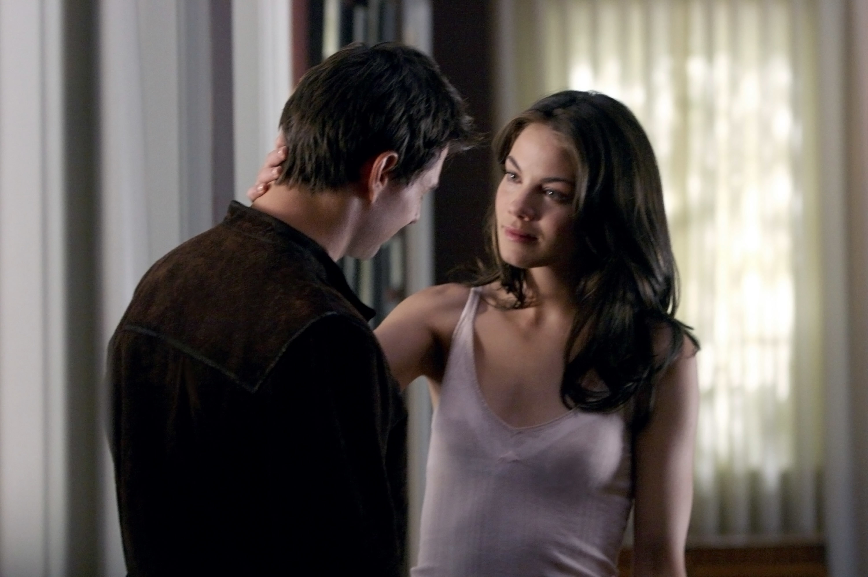 Tom Cruise and Michelle Monaghan looking at each other in a scene from "Mission: Impossible III"