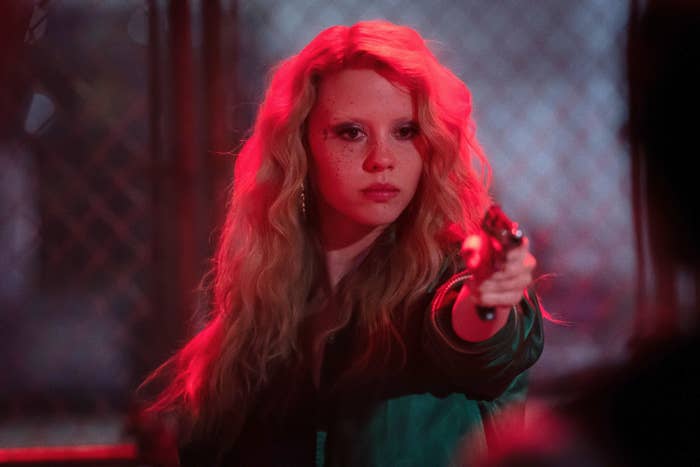 Mia Goth points a gun in a scene from "MaXXXine"