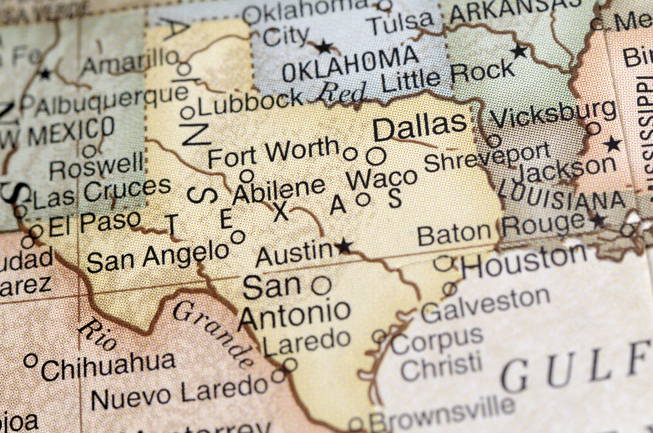 Close-up of a geographical map showing locations in Texas, including Dallas, Fort Worth, Houston, Austin, San Antonio, and surrounding areas