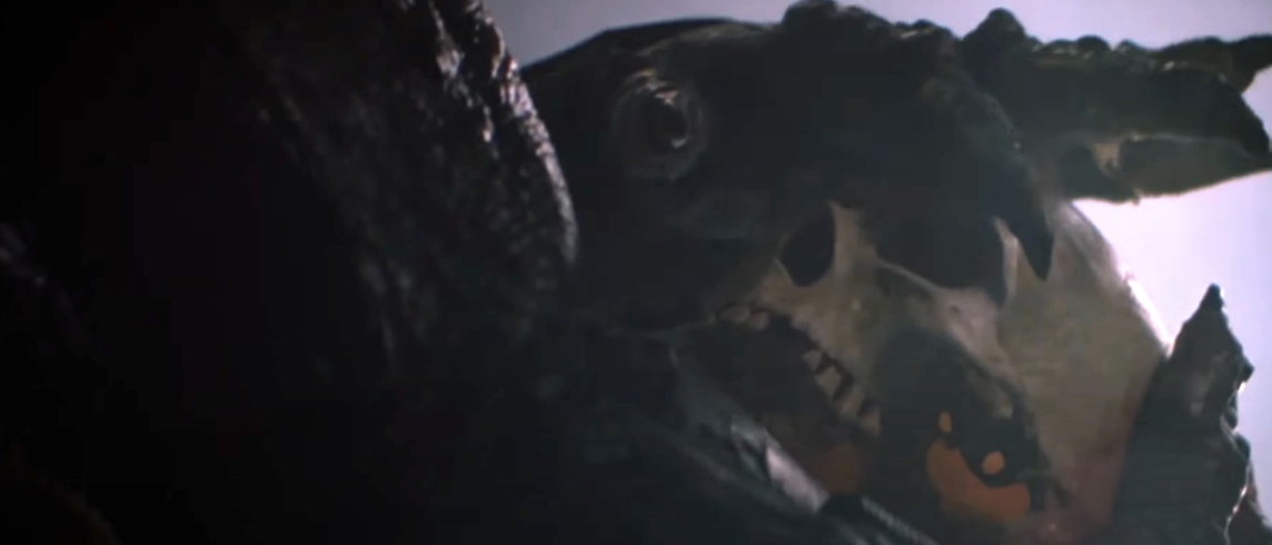A dramatic close-up of Predator alien's hands