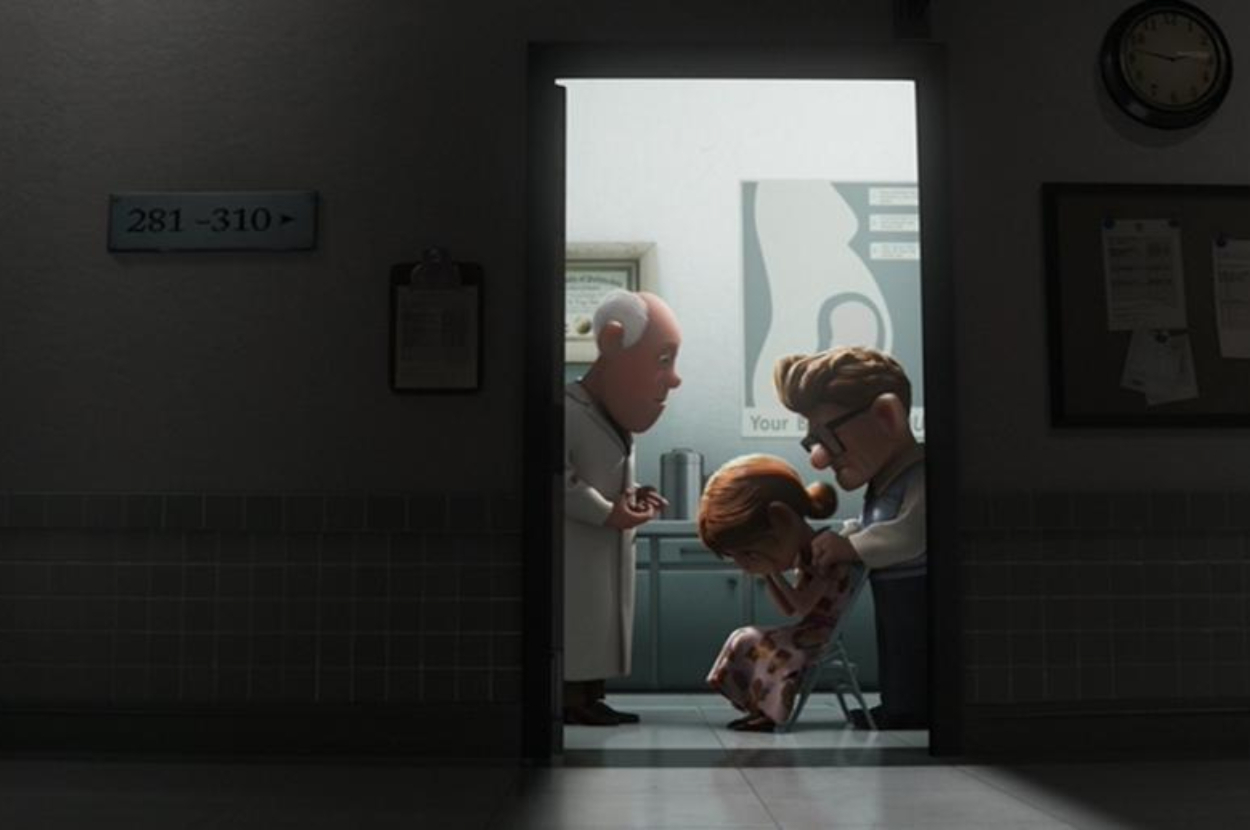 Animated scene with Carl Fredricksen, Ellie, and a doctor from "Up." Carl and the doctor comfort a seated Ellie in a clinical setting