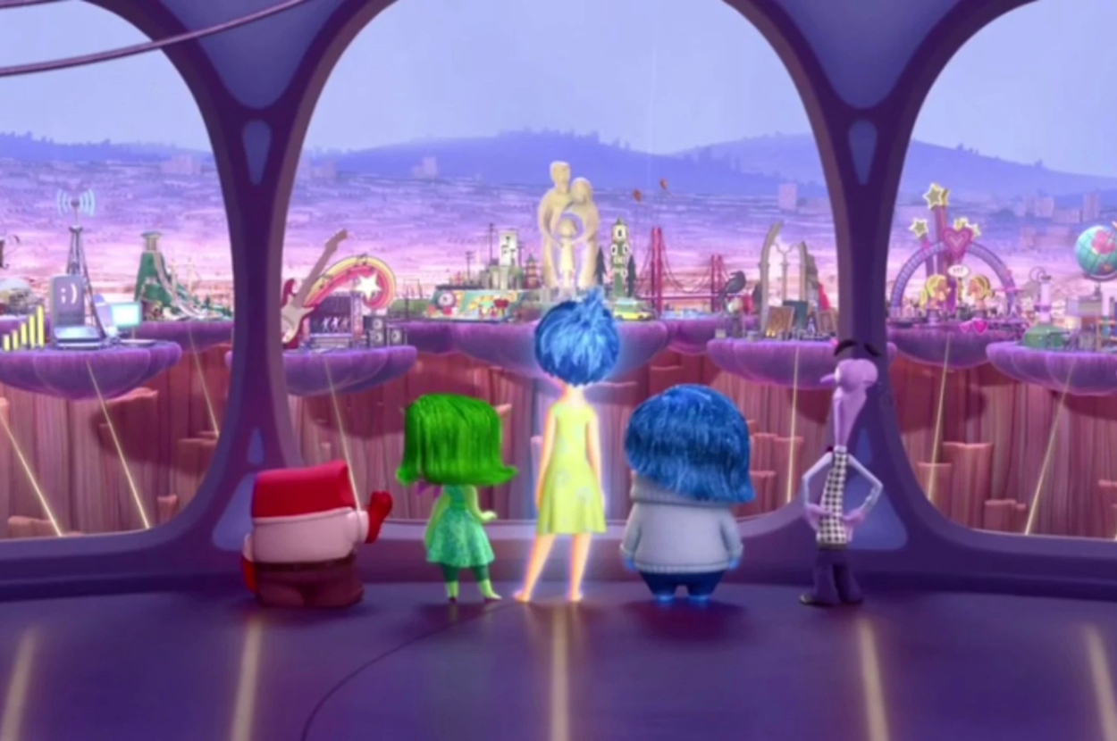 Disney Pixar's characters Anger, Disgust, Joy, Sadness, and Fear from "Inside Out" standing together, looking out at the imaginary world of Riley's mind