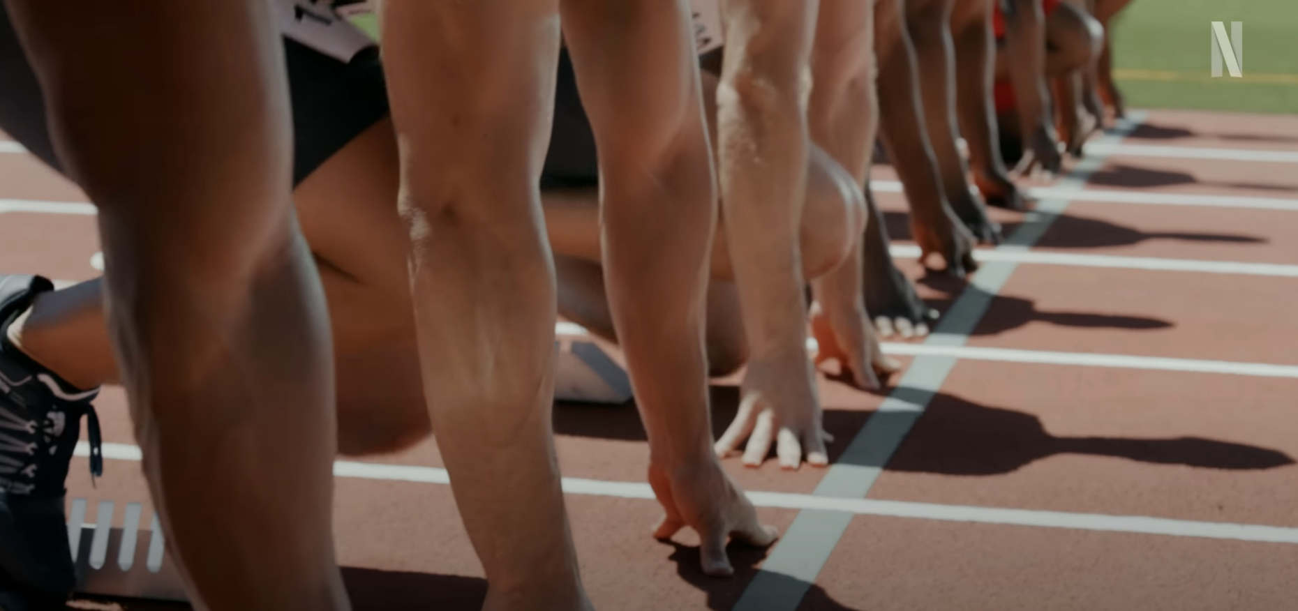 Athletes on the starting line, poised to begin a race on a track