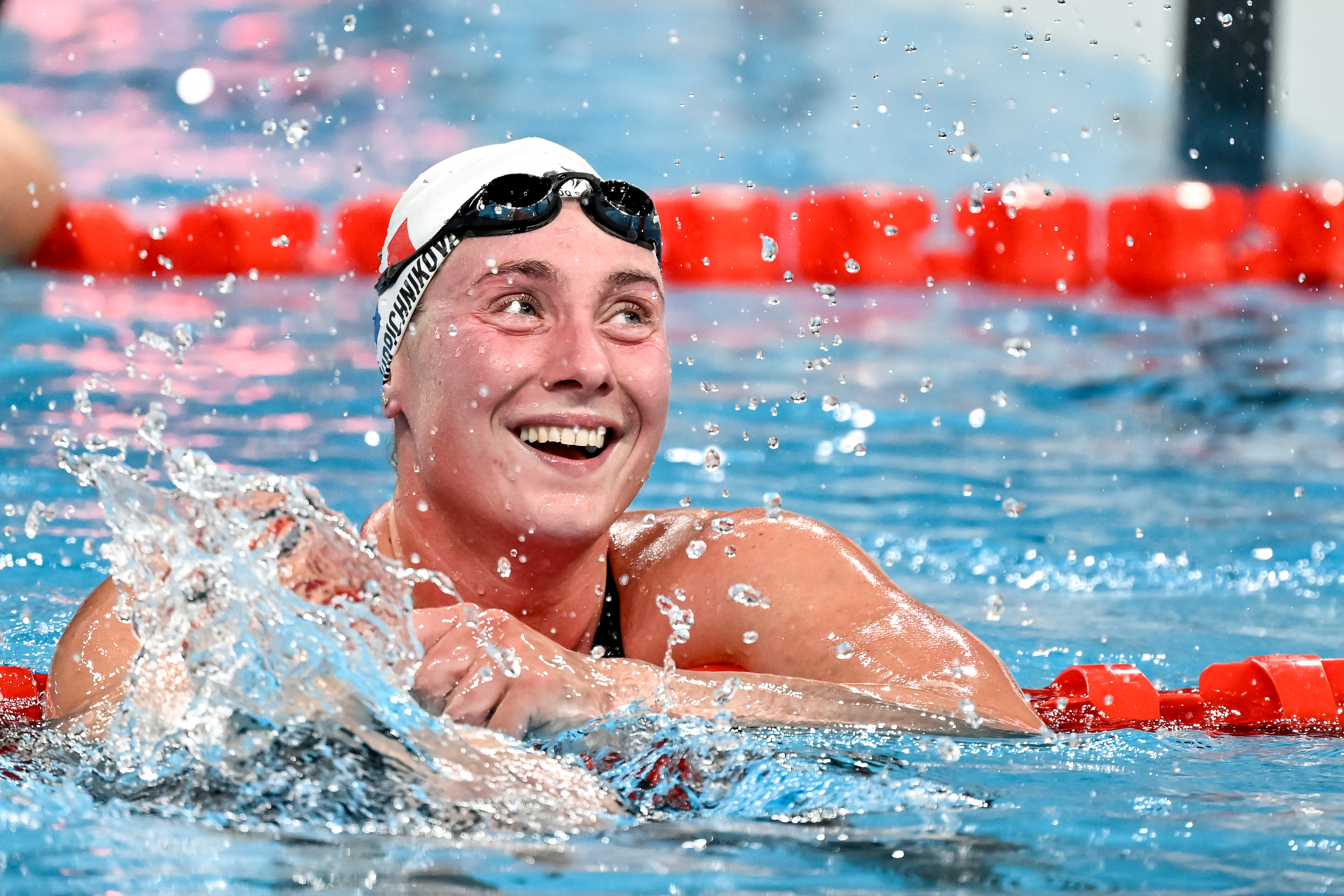 A swimmer celebrating at the Olympics
