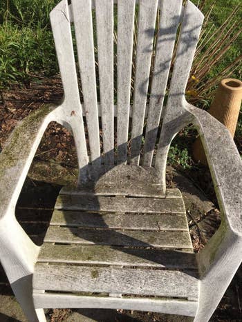 Reviewer's mold-covered achromatic patio seat earlier utilizing the stain remover spray
