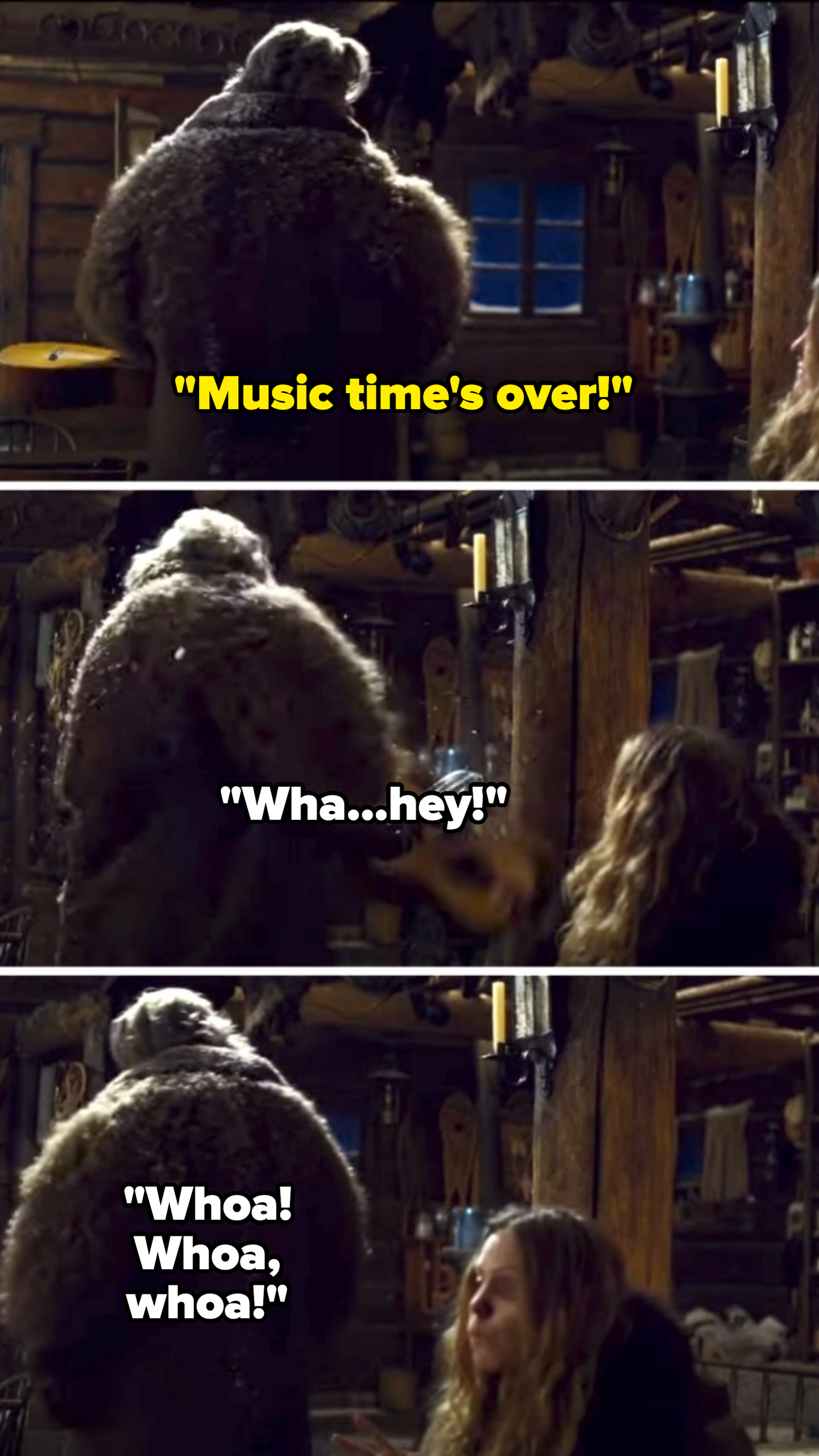 Kristoff, wearing a thick fur coat, interacts with Anna inside a cozy wooden cabin filled with various tools and shelves in a scene from Disney&#x27;s Frozen