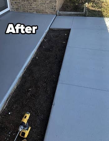 a reviewer photograph of the aforesaid sidewalk with slate grey overgarment applied labeled
