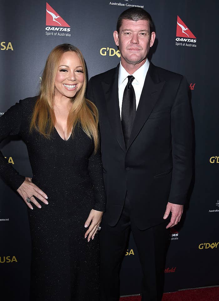 Mariah Carey in a form-fitting dress and James Packer in a suit at a red carpet event