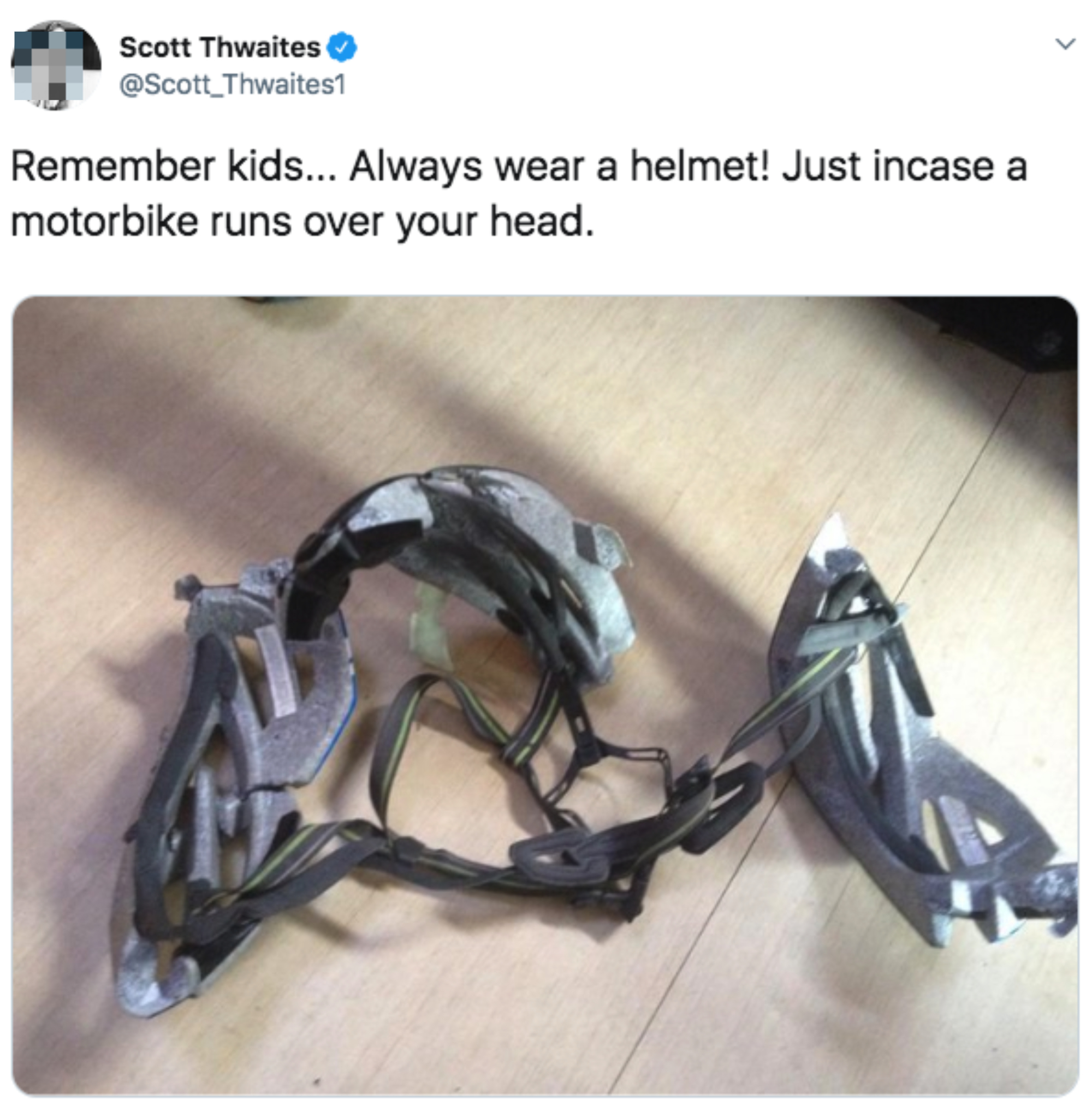 Broken protective helmet pieces with tweet text: "Remember kids… Always wear a helmet! Just incase a motorbike runs over your head." - Scott Thwaites (@Scott_Thwaites1)