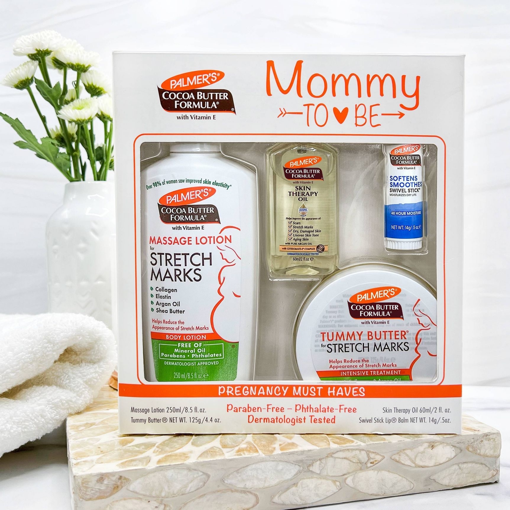 Palmer's Mommy-To-Be kit with stretch marks lotion, skin therapy oil, and tummy butter, essential for pregnancy skincare, adorned with the text &quot;Pregnancy Must Haves.&quot;