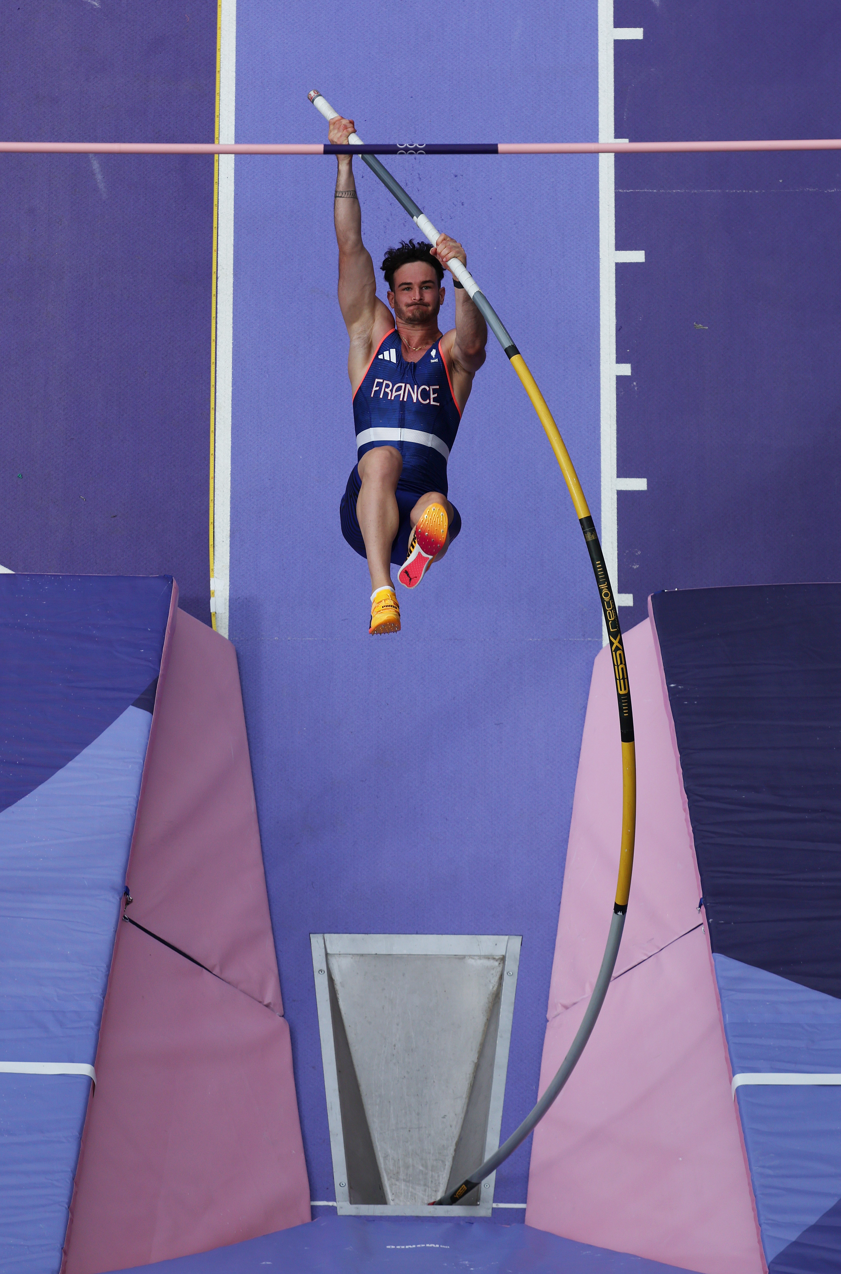 Pole vaulter Renaud Lavillenie from France in mid-air during a vault attempt in a sports competition