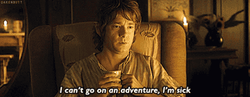 Bilbo Baggins from "The Hobbit" holds a mug with a reluctant expression, saying, "I can't go on an adventure, I'm sick."