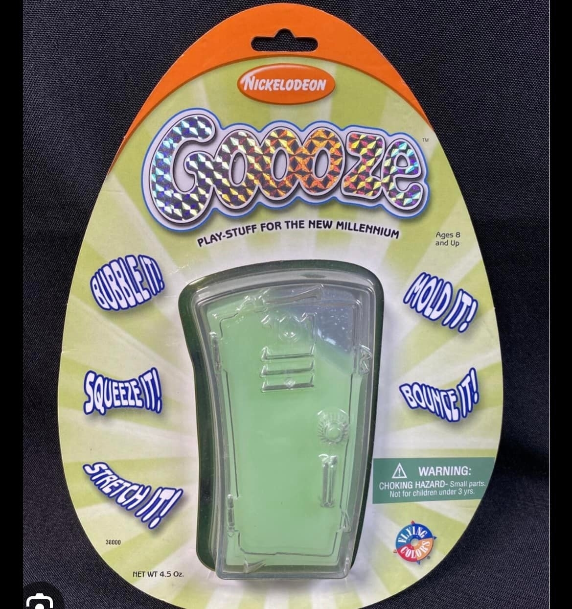 "Nickelodeon Goooze package, labeled 'Play-Stuff for the New Millenium', displaying phrases like 'Bubble It!', 'Squeeze It!', 'Hold It!', 'Stretch It!', 'Bounce It!'