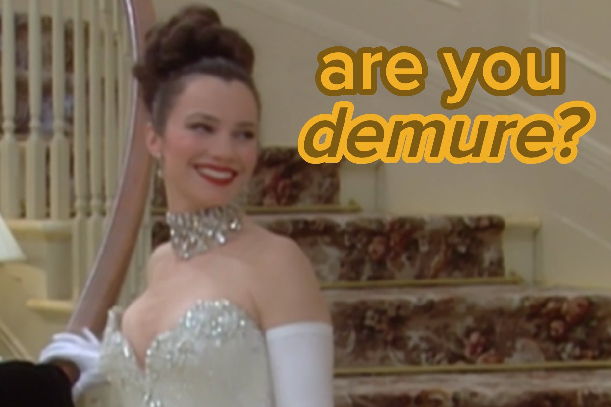 Fran Fine from The Nanny, in an elegant gown with an off-the-shoulder design, smiles on a staircase with the text "are you demure?" in the top right