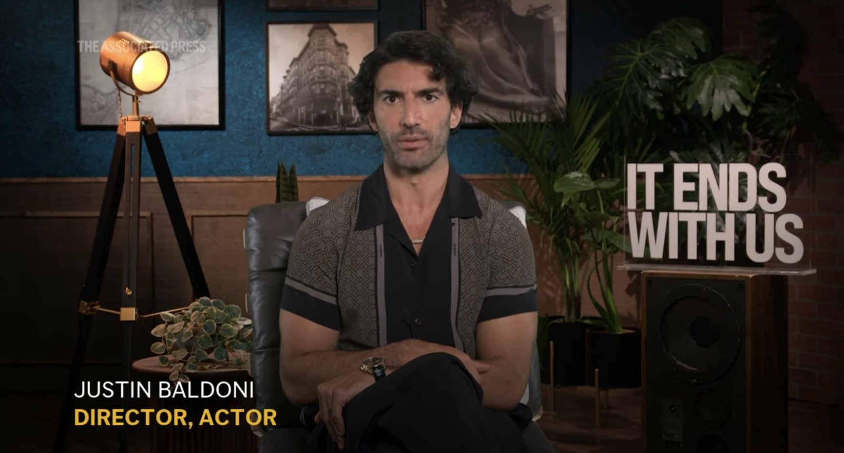 Justin Baldoni, director and actor, sits in a studio setting promoting "It Ends With Us."