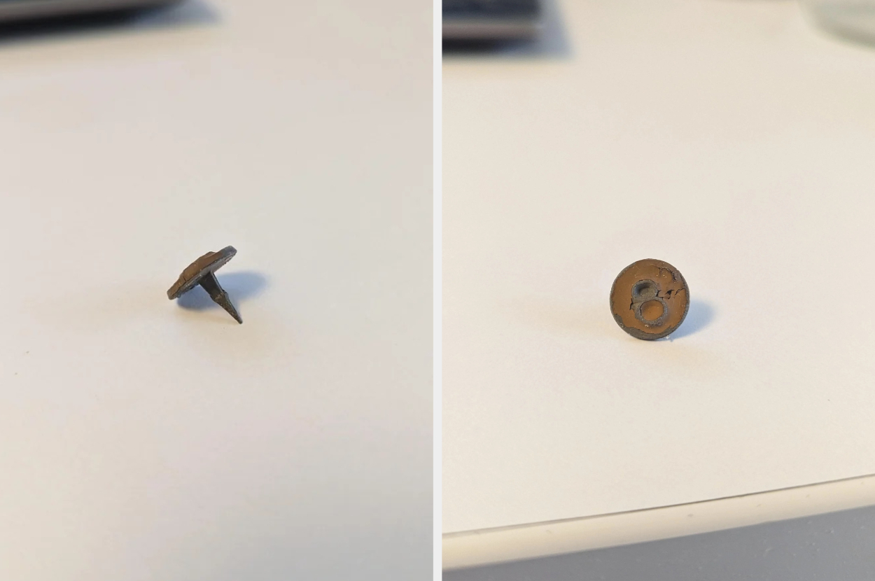 A small, round, rusty thumbtack with a bent point is shown from different angles on a white surface; there is an "8" on the top