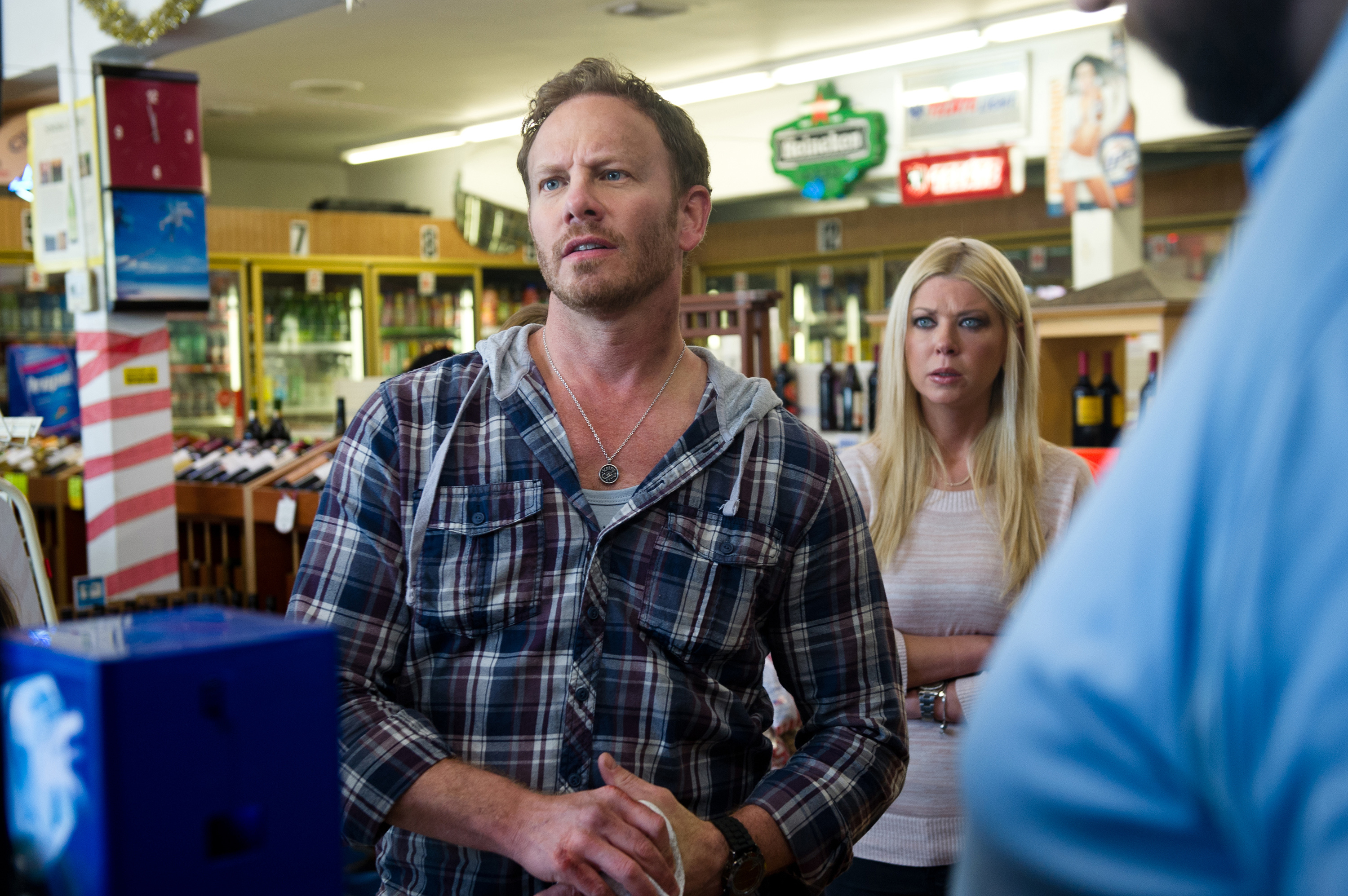 Ian Ziering and Tara Reid in a convenience store in &quot;Sharknado&quot;