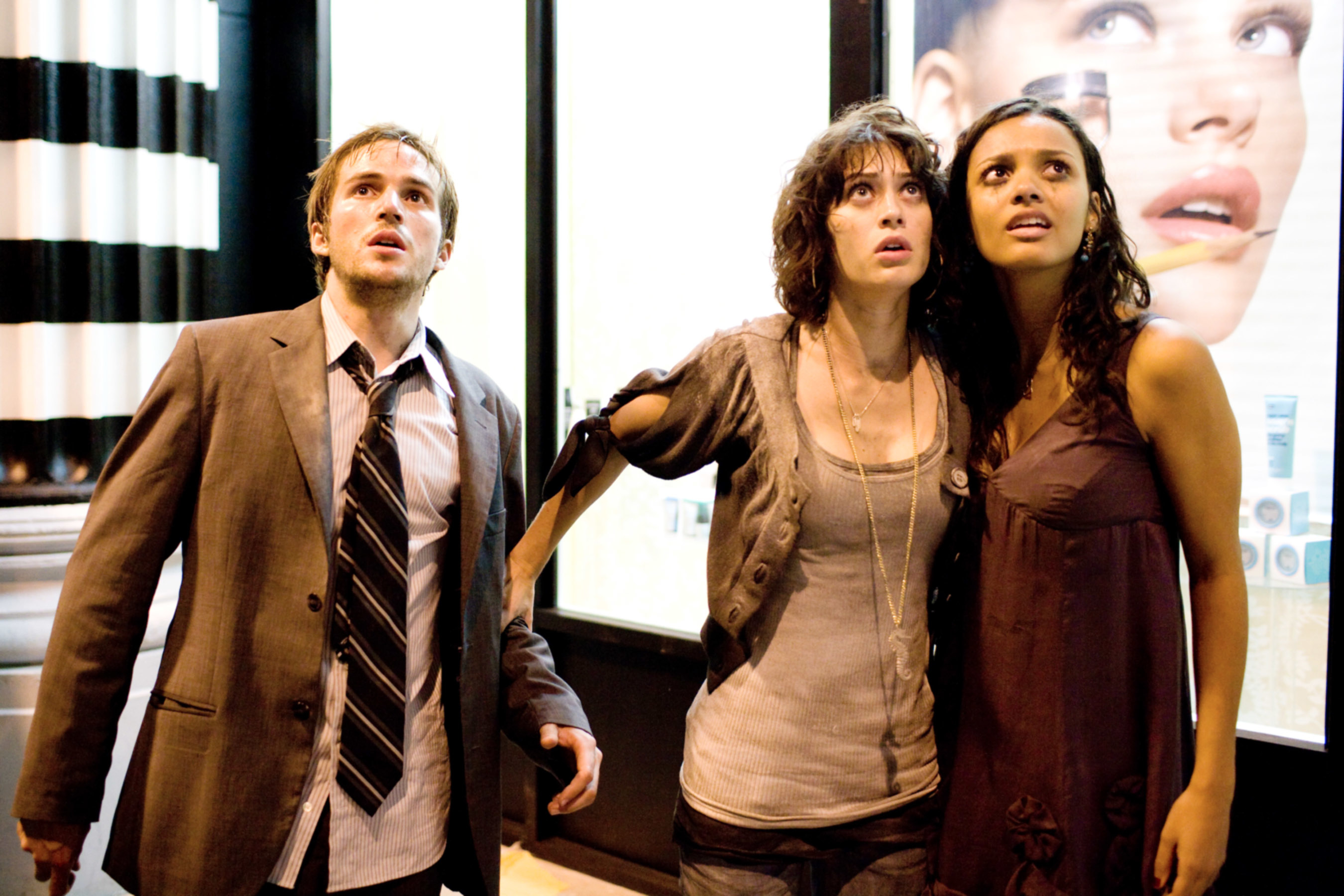 Michael Stahl-David, Lizzy Caplan, and Jessica Lucas standing together in &quot;Cloverfield&quot;