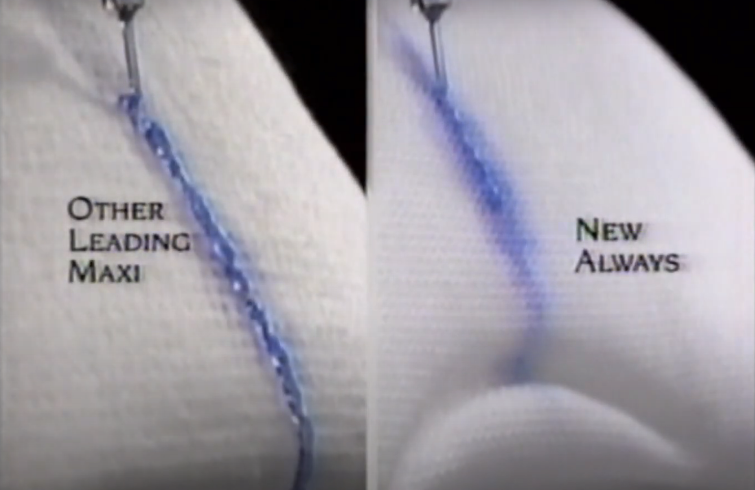 Close-up of absorbency test comparing &quot;Other Leading Maxi&quot; on the left and &quot;New Always&quot; on the right, showing liquid flow on sanitary pads