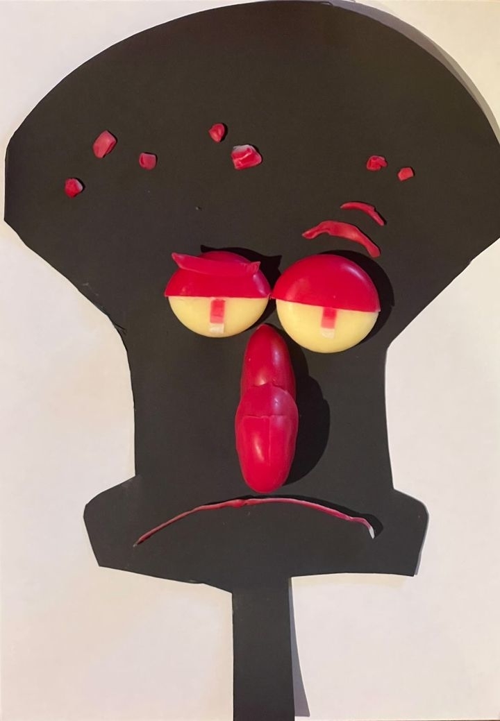 Stylized SpongeBob SquarePants character Squidward with a frowning expression, crafted from food items like candies and cheese