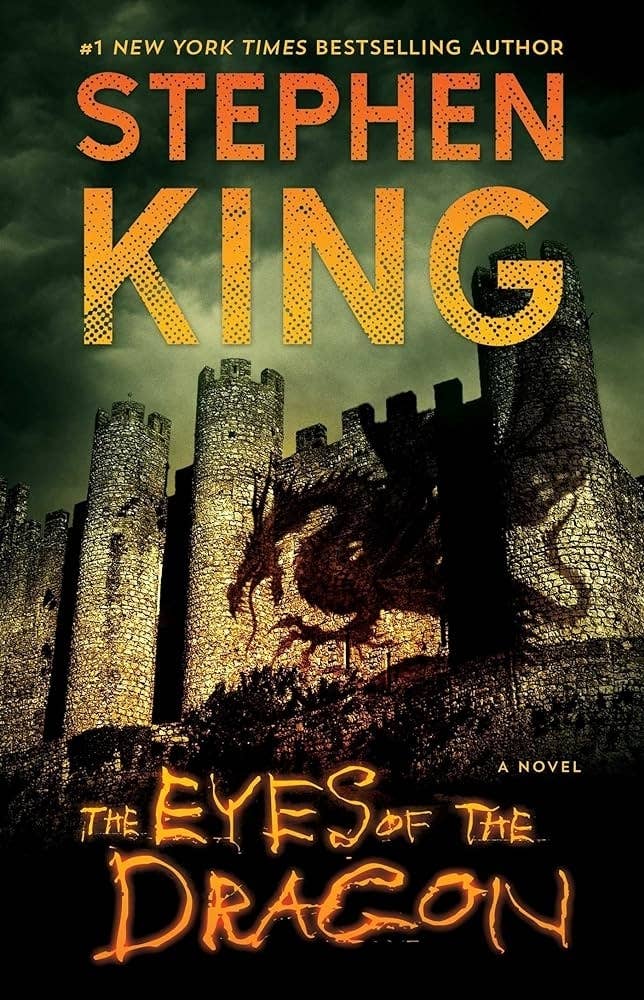 Cover of "The Eyes of the Dragon" by Stephen King, featuring a dragon and a medieval castle