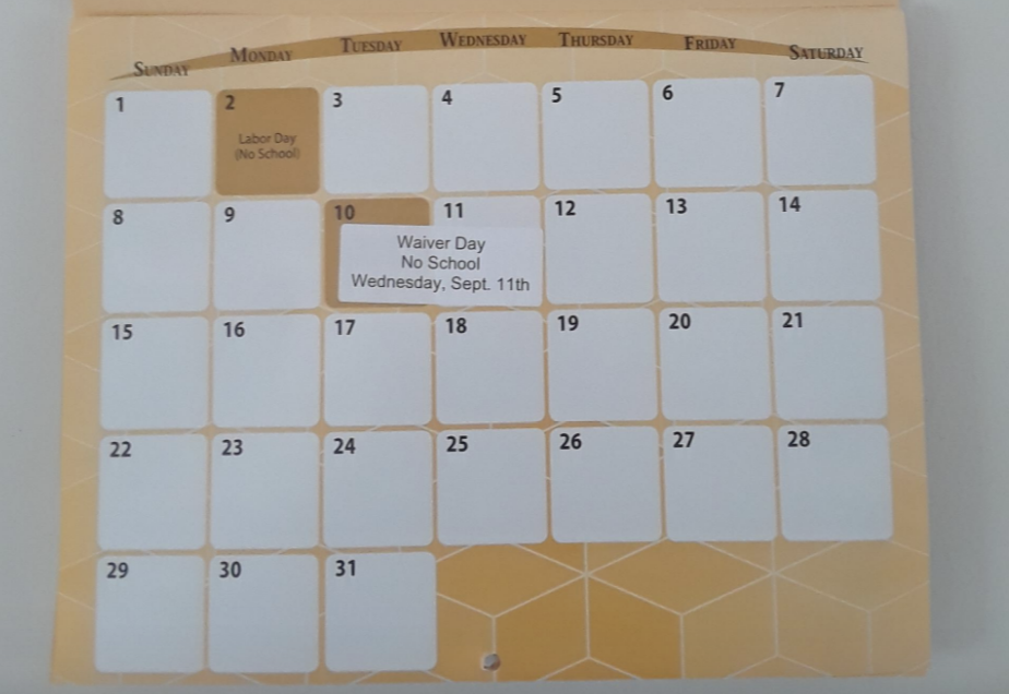 September calendar page featuring Warren G. Harding High School Raider Band. Highlights include Labor Day on the 2nd and no school on the 11th for Waiver Day