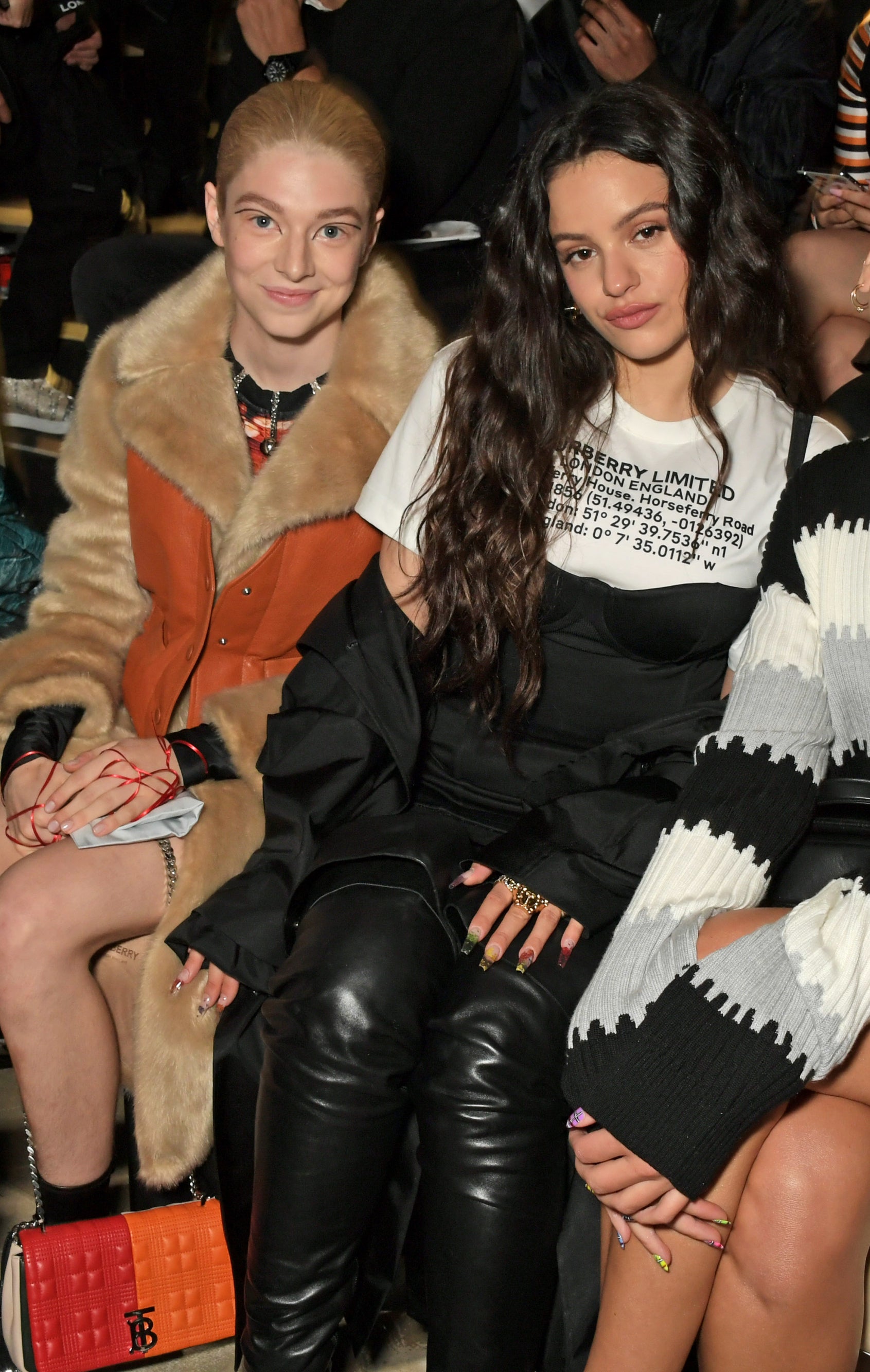 Hunter and Rosalía sitting together at a fashion event