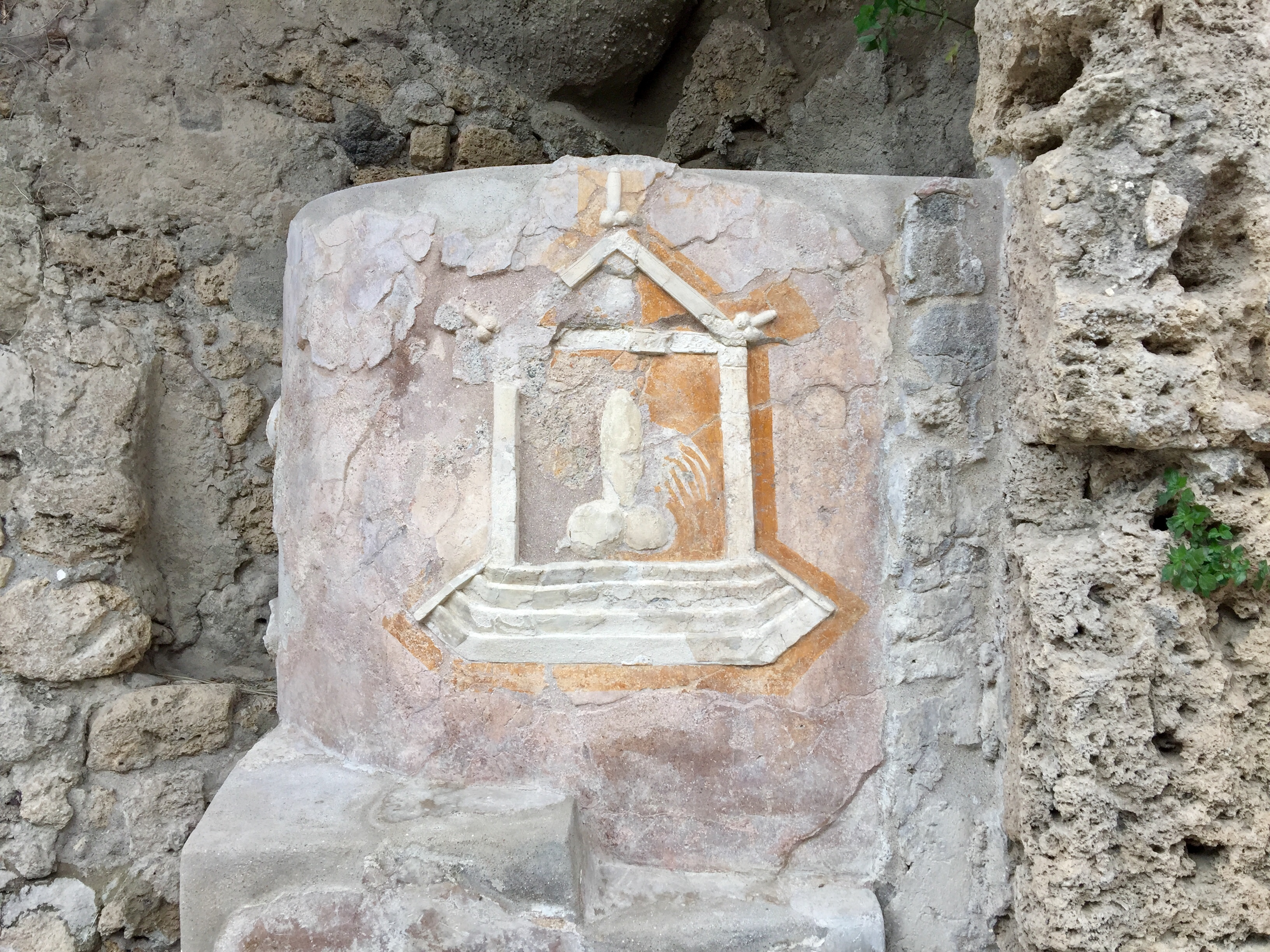 An phallic carving in a rock located in the ruins of Pompeii, Italy