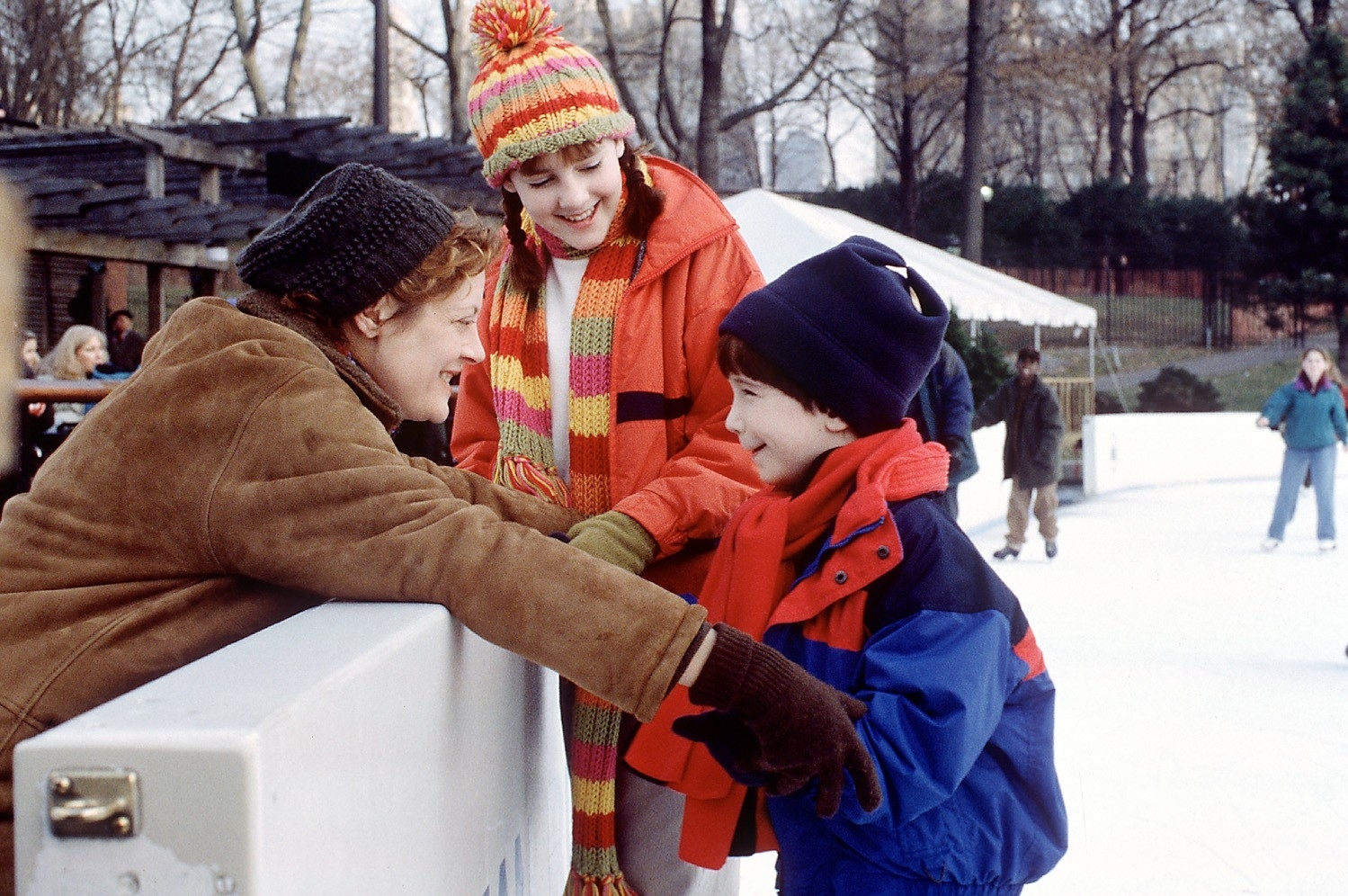 Susan Sarandon, Jena Malone, and Liam Aiken at an ice skating rink in a scene from "Stepmom"