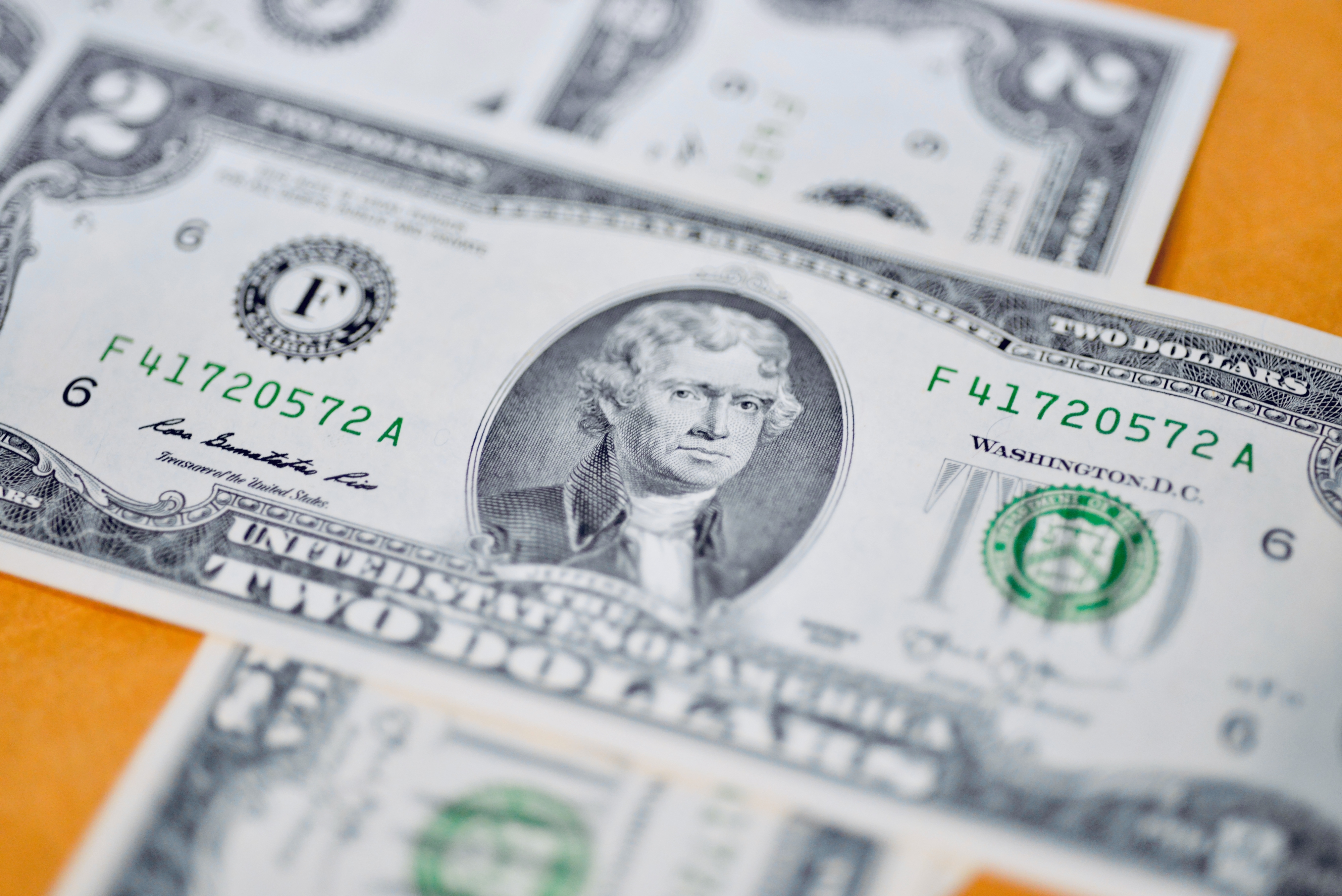 Close-up of US two-dollar bills featuring Thomas Jefferson's portrait