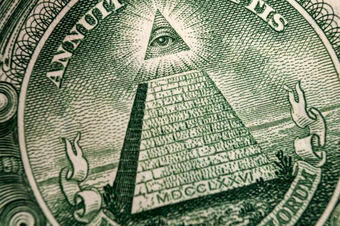Close-up of the Eye of Providence symbol on a U.S. one-dollar bill