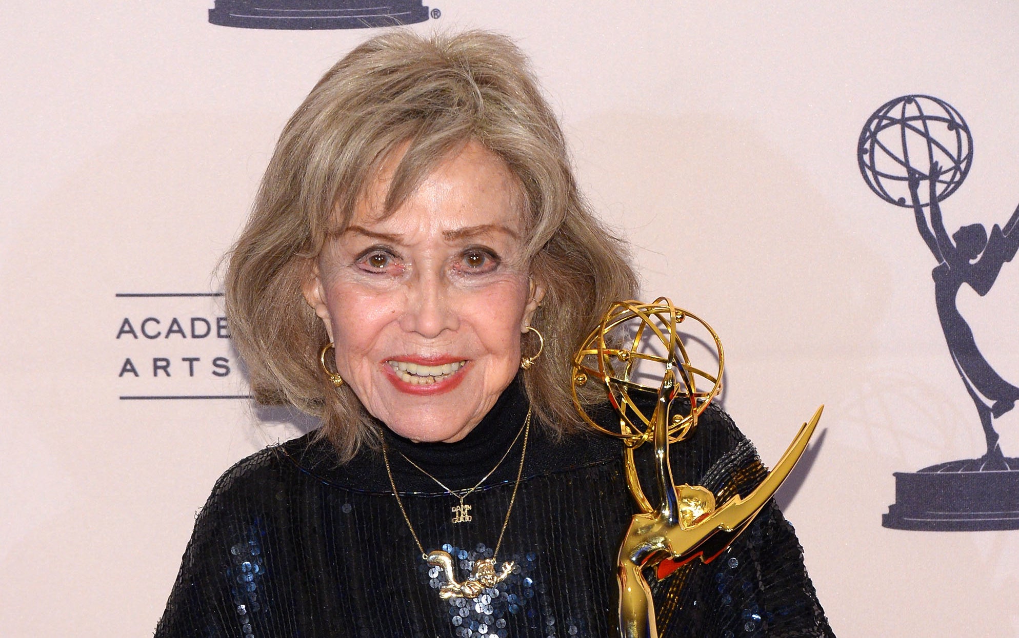 June Foray holds an Emmy award