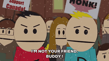 Cartoon characters Terrance and Phillip stand in a crowd with signs. Text reads: &quot;I'm not your friend, buddy!&quot;