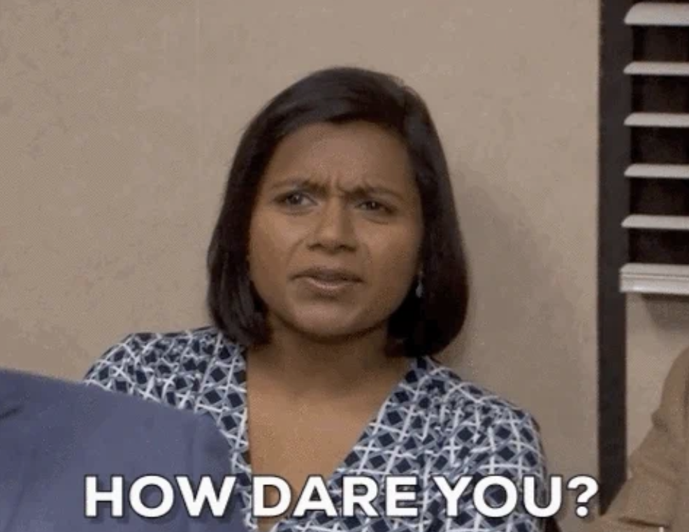 Mindy Kaling looks confused and upset, with the text &quot;HOW DARE YOU?&quot; superimposed at the bottom of the image