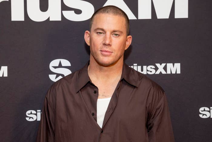 Channing Tatum at a SiriusXM event, wearing a casual button-down shirt over a white undershirt