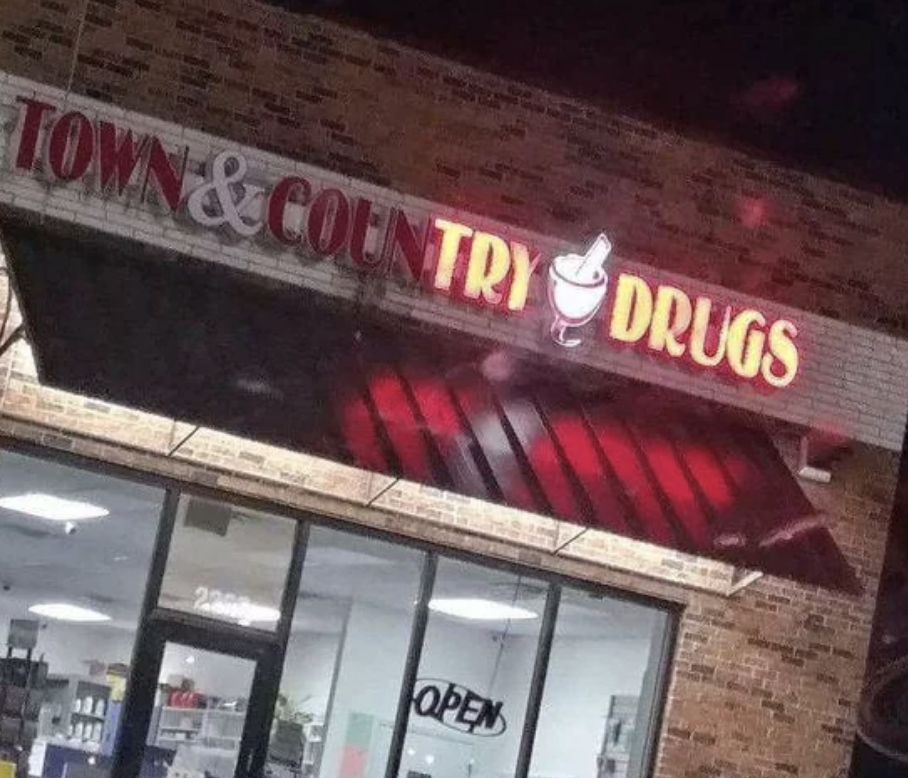 Town & Country Drugs store with illuminated sign