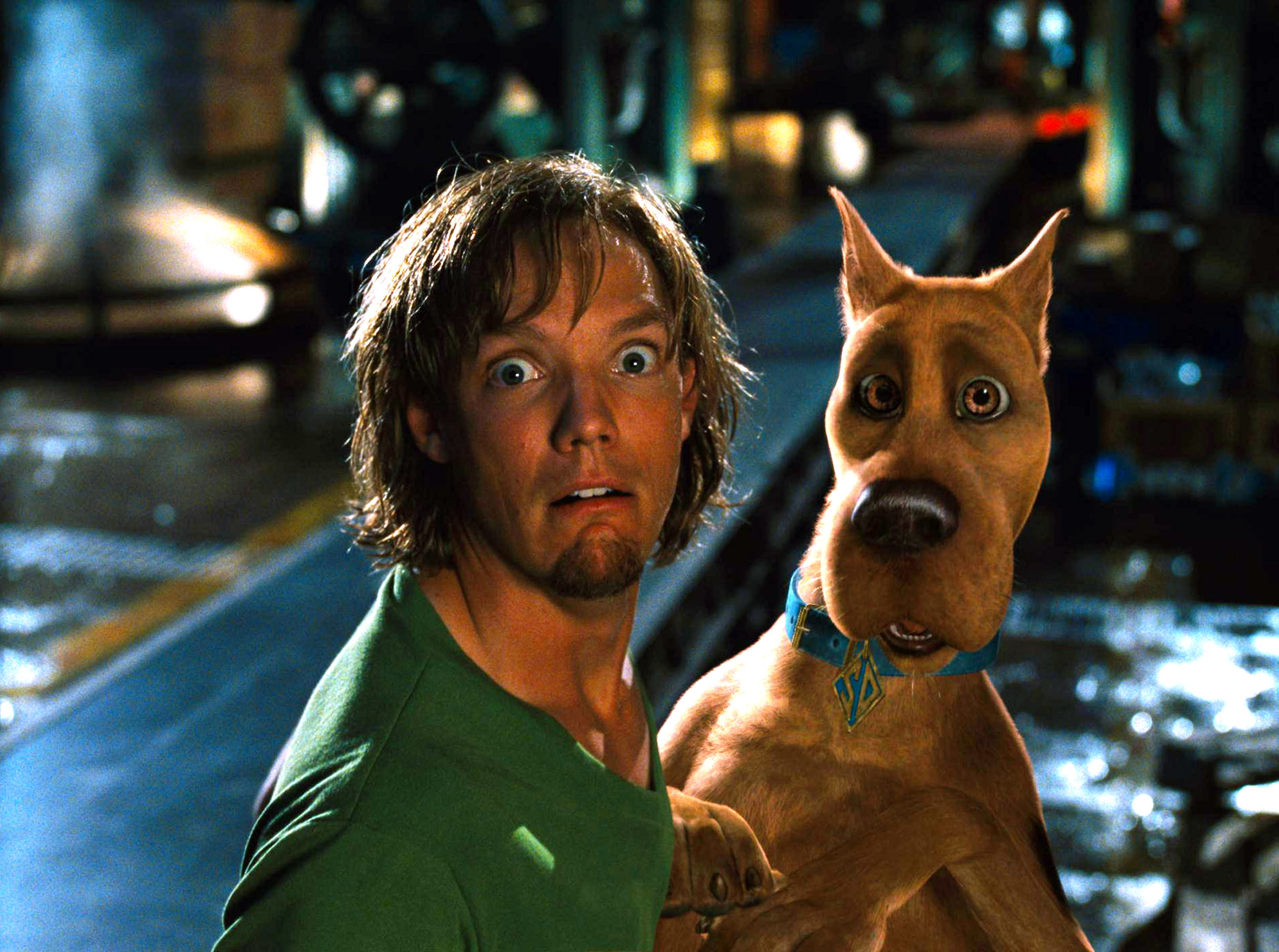 Shaggy (played by Matthew Lillard) and Scooby-Doo looking surprised in a scene from a movie