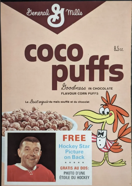 General Mills Coco Puffs cereal box featuring a cartoon bird and a free hockey star picture offer with an image of a hockey player