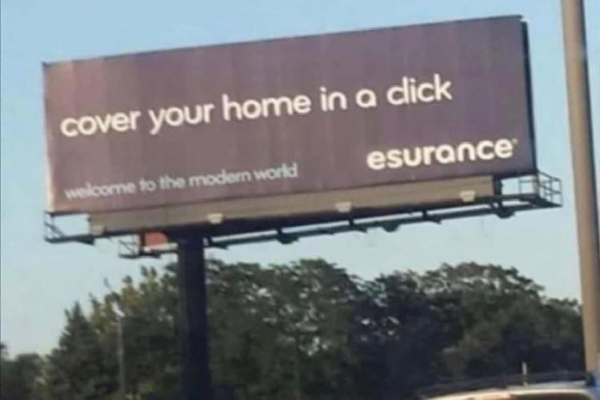 A billboard with a typo advertises Esurance with the text "Cover your home in a click" but spells "click" as "dick"